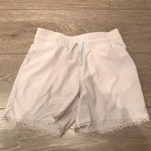 Cream colour Ivivva shorts.